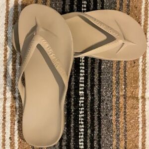 Archie’s flip flops, never worn, size 10, purchased online direct, nude color.